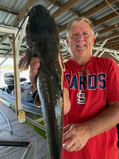Fisherman Mine with a nice one caught and released Under blackburns Resort and Boat Rental's Dock. 