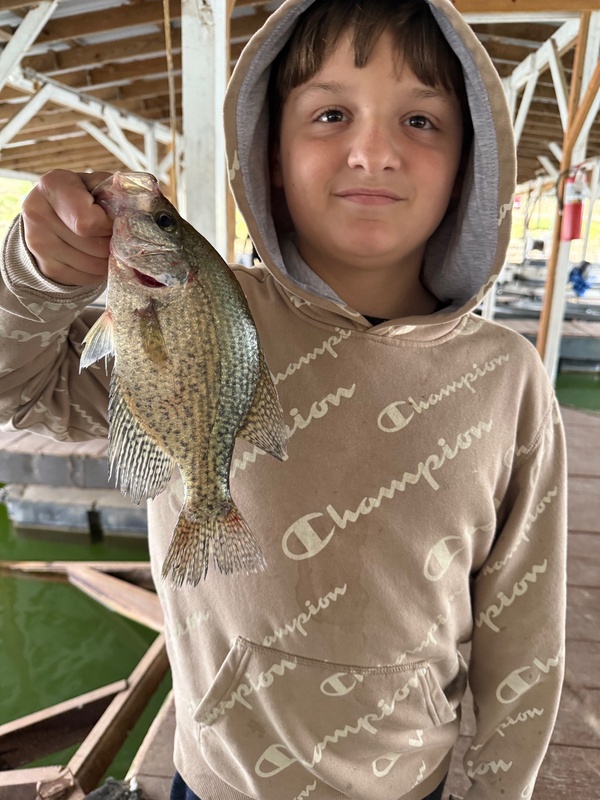 Isaiah McMackins loves to Fish on Scuba Steve's Dock. We do not mind having him around either. 