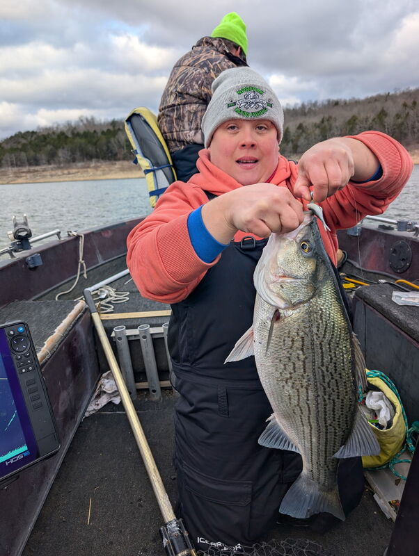 Liz Welch with her first fish yesterday. 